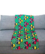 Plaid Africa lanterne rouge et jaune sur fond vert